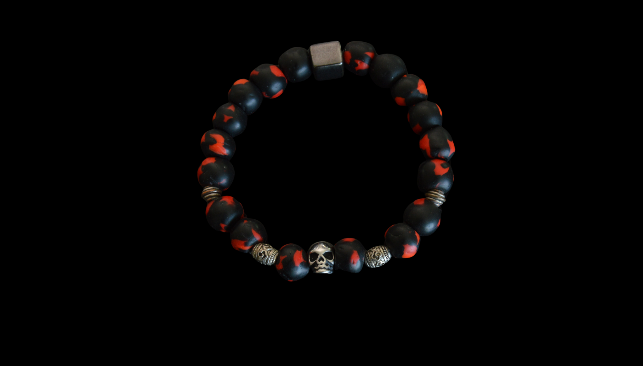 Bracelet with black and red beads on a black background